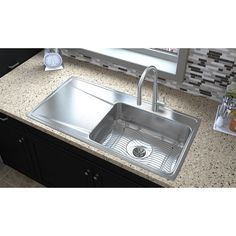 An Elkay Lustertone Classic stainless steel sink looks as great on day 3, 000 as it does on day one. The rich, uniform grain is scratch resistant for heavy-duty use, whether it's a kitchen sink or a prep, bar, laundry or commercial sink. Light scratches, which occur with everyday use, naturally blend into the finish of this Durable sink with time. Deeper scratches are repairable with an Elkay stainless steel restoration kit. Available in ADA depths. Elkay Gourmet Drop-In 43-in x 22-in Lustertone Stainless Steel Single Bowl 2-Hole Workstation Kitchen Sink with Drainboard | ILR4322R2 Kitchen Sink Drainboard, Sink With Drainboard, Sink Light, Drainboard Sink, Commercial Sink, Drop In Kitchen Sink, Kitchen Sink Stainless Steel, Sink Grid, Drop In Sink