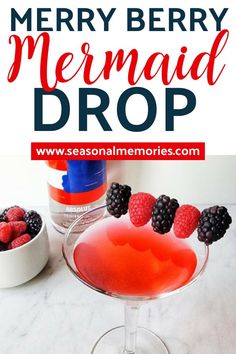 a drink with berries on top and the words merry berry mermaid drop