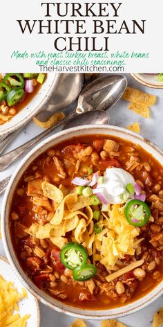 a bowl of turkey white bean chili with tortilla chips