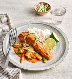 a white plate topped with chicken and rice