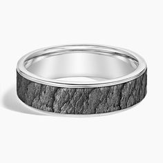 a wedding band with black stone inlay