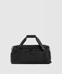 EVERYDAY FOR ANY DAY Your work-to-gym hybrid. The Everyday Holdall is specifically designed for your everyday items, with a wet pocket for gym kit and slip pockets for work essentials, as well as a main-entry space for anything else you need for the journey. Complete with super comfy padded carry handles and shoulder strap. - Small holdall bag- One main entry- Over-shoulder strap and padded carry handles- Elasticated mesh slip pocket- PU base- Shoe tunnel- Wet pocket- YKK hardware with rubberis… Small Gym Bag, Shark Bag, Gym Kit, Holdall Bag, Gym Shark, Work Essentials, Aerobics Workout, Gym Essentials, Zip Puller