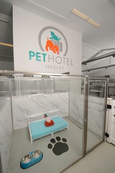 a dog grooming shop with pet beds and washers in the back ground, on display