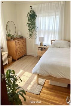 a bed sitting in a bedroom next to a window