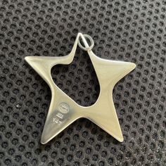 A lovely Georg Jensen Sterling Silver Star shaped pendant in design number 147. The pendant was designer by Henning Koppel in 1972 and is now retired. The pendant measures 2 1/4 inches by 2 1/4 inches (60 mm) and in diameter. It was created in Denmark.   The pendant is fully hallmarked by the Jensen Silversmithy as follows:  1. Georg Jensen mark (post 1945)  2. .925 (Sterling Silver) 3.Denmark  Should you have any questions, please do not hesitate to ask. So you may purchase with confidence, we Design Number, Star Pendant Necklace, Jewelry Lookbook, Georg Jensen, Jewelry Inspo, Star Pendant, Silver Stars, Star Shape, Sterling Earrings