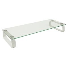 a glass and metal coffee table on a white background with the bottom part of it visible