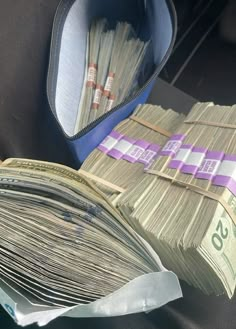 stacks of money are sitting in the back seat of a car, next to a wallet