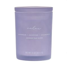 lavender and jasmine chamomi candle in a glass jar on a white background