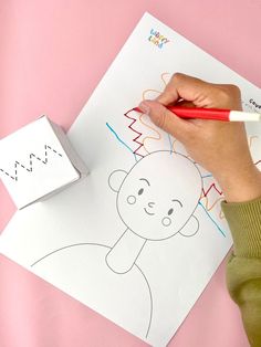 a child's hand drawing on a piece of paper