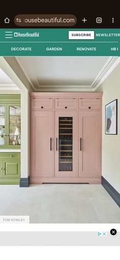 an image of a kitchen with pink cupboards and green cabinets in the corner,