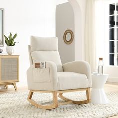 a living room with a white chair and table