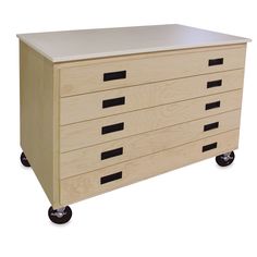 a wooden dresser with four drawers on wheels