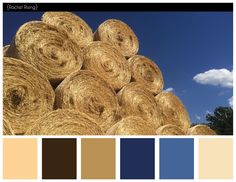 a bunch of hay bales stacked on top of each other with blue sky in the background