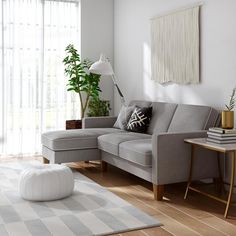 a living room scene with focus on the corner sofa