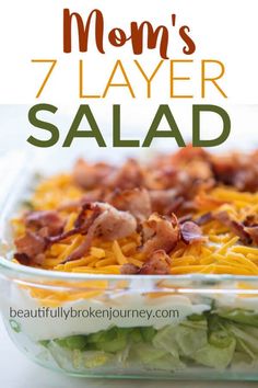 a salad with bacon, cheese and lettuce in a casserole dish