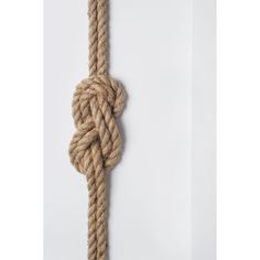 a rope that has been tied to the side of a wall with a knot on it