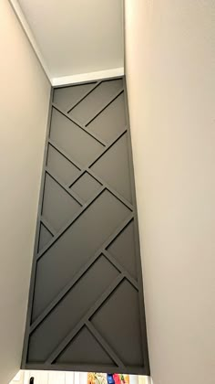 the corner of a room with an interesting design on it