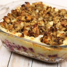 a casserole dish with crumbled toppings on top