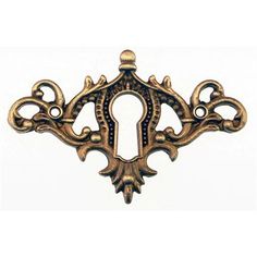 an ornate brass door handle on a white background