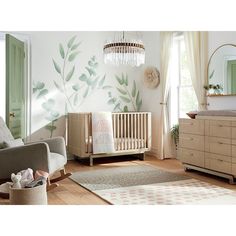 a baby's room with a crib, rocking chair, dresser and mirror