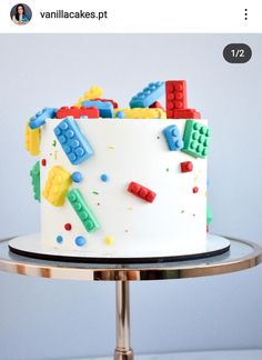 a white cake with legos on it