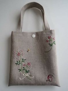 an embroidered bag hanging on the wall