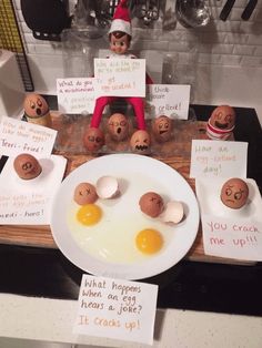 an elf is sitting at the table with eggs and other funny things on it's plate