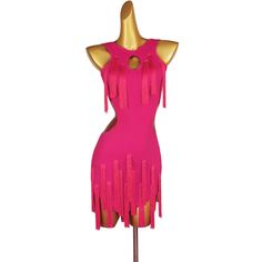 a pink dress on a mannequin with tassels and holes in the back