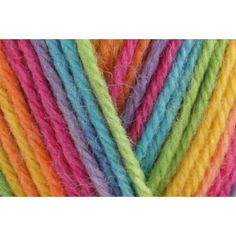 multicolored skeins of yarn on white background