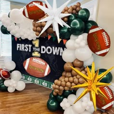 balloon arch with footballs, stars and balloons