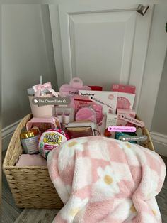 a basket filled with items sitting on top of a floor next to a white door