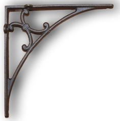 an ornate iron shelf bracket on a white background