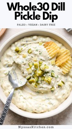 a white bowl filled with potato dip and chips