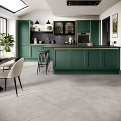 a large kitchen with green cabinets and counter tops in an open floor plan, along with two bar stools