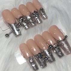 These are handmade press on's created by me! What's included? - 10 nails - nail glue - file - cuticle pusher - instructions Nail Shape in the photo: XXL Coffin Nails are made to order so you can pick any length, size, and shape. Please know that order processing time is 5-7 business days because the nails need to be made and personalized to your preference. They can last 1-3 weeks depending on how well you prep your nails. Message me if you would like a custom press on set! White Chrome Christmas Nails, Long Nails With Charms, Pierced Nails, Piercing Nails, Ongles Goth, Nails Charm, Nails With Charms, Hearts Nails, Charm Nails