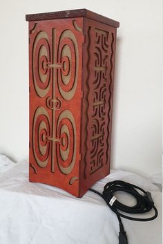 Lamp is made of wood, sides are made of plywood and top is made of 2cm thick wooden plate. Dimensions (cm) are 20x20x49.  Symbols on Lamp are inspired by Polynesian culture. Elements Tattoo, Wooden Plate, Polynesian Culture, Lampe Decoration, Wooden Plates, Wooden Lamp, Decorative Elements, Made Of Wood, Home Deco