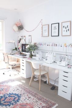 a white desk topped with lots of drawers next to a window