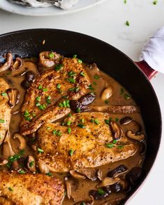 chicken with mushrooms and mushrooms in a skillet