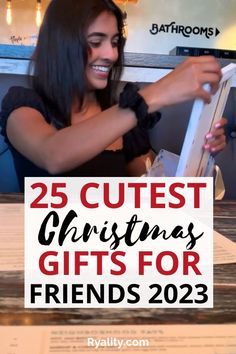 a woman holding up a sign that says 25 cutest christmas gifts for friends