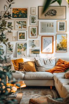 a living room filled with lots of pictures on the wall