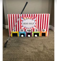 a golf themed card board with a hole in the middle and two balls on each side