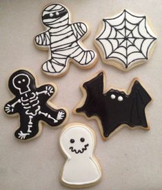 halloween cookies decorated with black and white icing