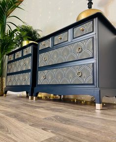 two blue dressers sitting next to each other on top of a hard wood floor