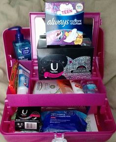 a pink suitcase filled with personal care items