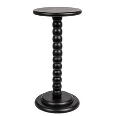 a small black table with wooden legs and a round top on an isolated white background