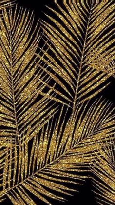 golden palm leaves against a black background