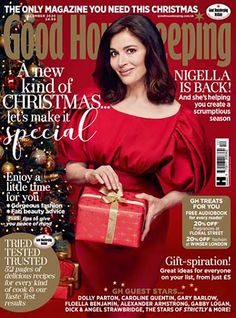 a magazine cover with a woman holding a christmas present in front of a christmas tree