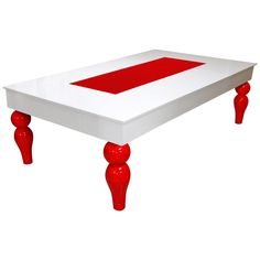 a red and white coffee table with two legs on each side, in front of a white background