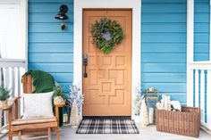 the front porch is decorated for christmas with wreaths and decorations