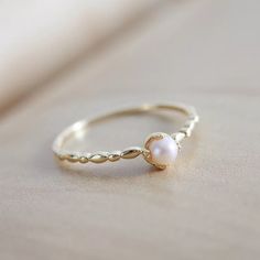 Luxury Handmade Pearl Promise Ring, Gold Pearl Birthstone Ring, Gold Pearl Promise Ring In 14k Gold, Heirloom Gold Pearl Ring With Birthstone, Dainty Gold Pearl Ring With Birthstone, Heirloom Pearl Ring As A Gift, Heirloom Pearl Ring Gift, Heirloom Style Pearl Ring Gift, Pearl Promise Rings